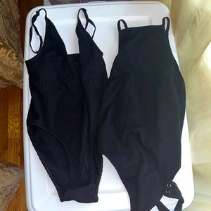two black body suits